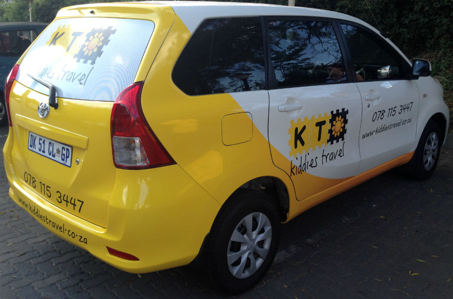 A clean, modern shuttle van ready for school transport.